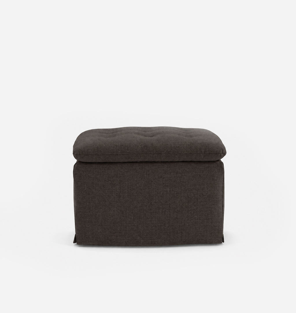 A dark brown upholstered ottoman with a tufted top, shown against a plain white background.