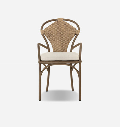 A classic French bistro dining chair with a curved brown metal frame, a woven natural wicker backrest, and a cream-colored seat cushion, shown against a plain light gray background.