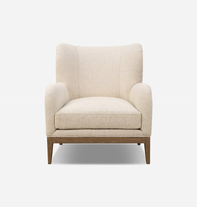 A modern wingback armchair with textured cream-beige bouclé upholstery and a medium brown wooden base, shown against a plain white background.
