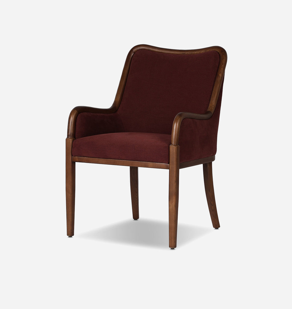 A classic high-back armchair with deep burgundy velvet upholstery and a curved dark brown wooden frame, shown against a plain light gray background.