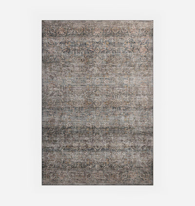 A rectangular area rug with a distressed, vintage-style traditional pattern in muted gray, beige, and brown tones, shown flat against a light gray background.