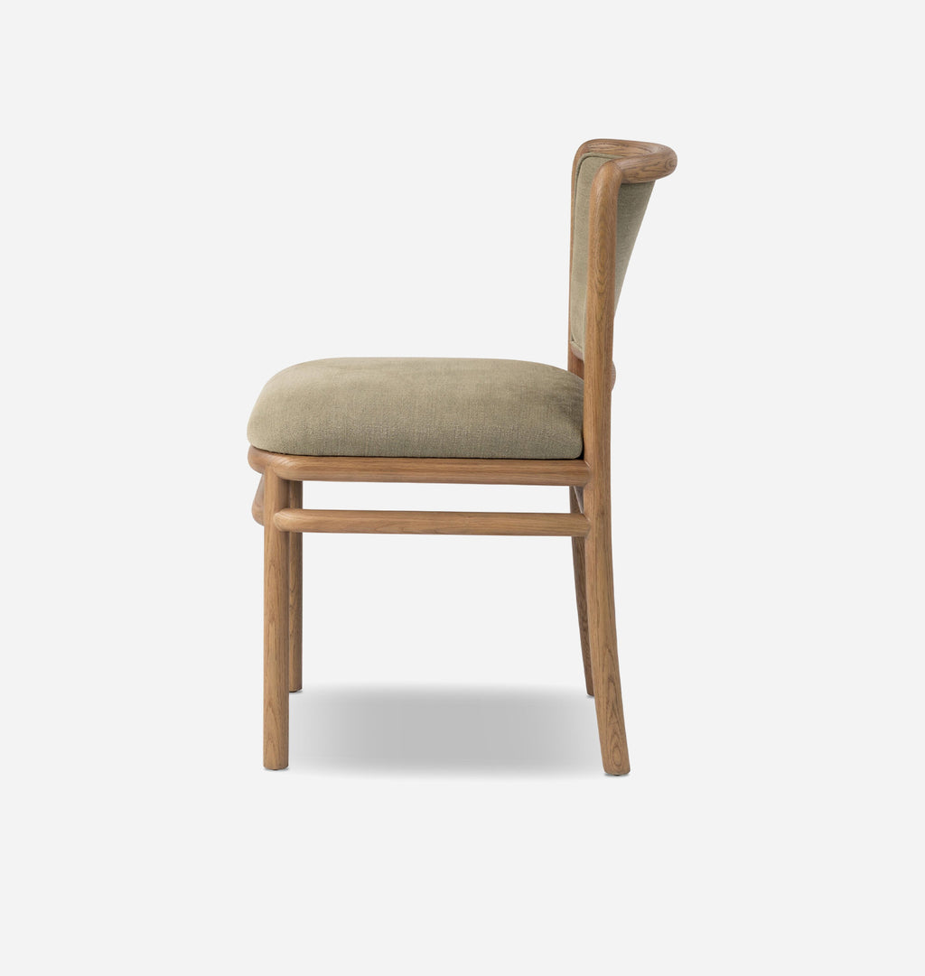 A single wooden dining chair shown from the side against a light gray background. The chair features a natural oak wood frame with a curved backrest and legs, and a light beige upholstered seat cushion.