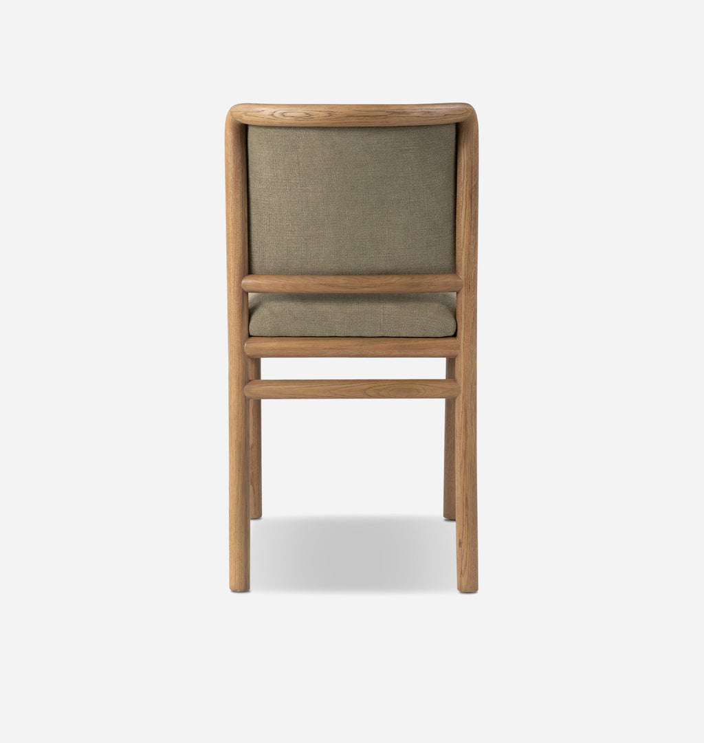 A wooden dining chair with a light oak frame and muted sage green fabric upholstery on the backrest and seat, shown from the front against a light gray background.