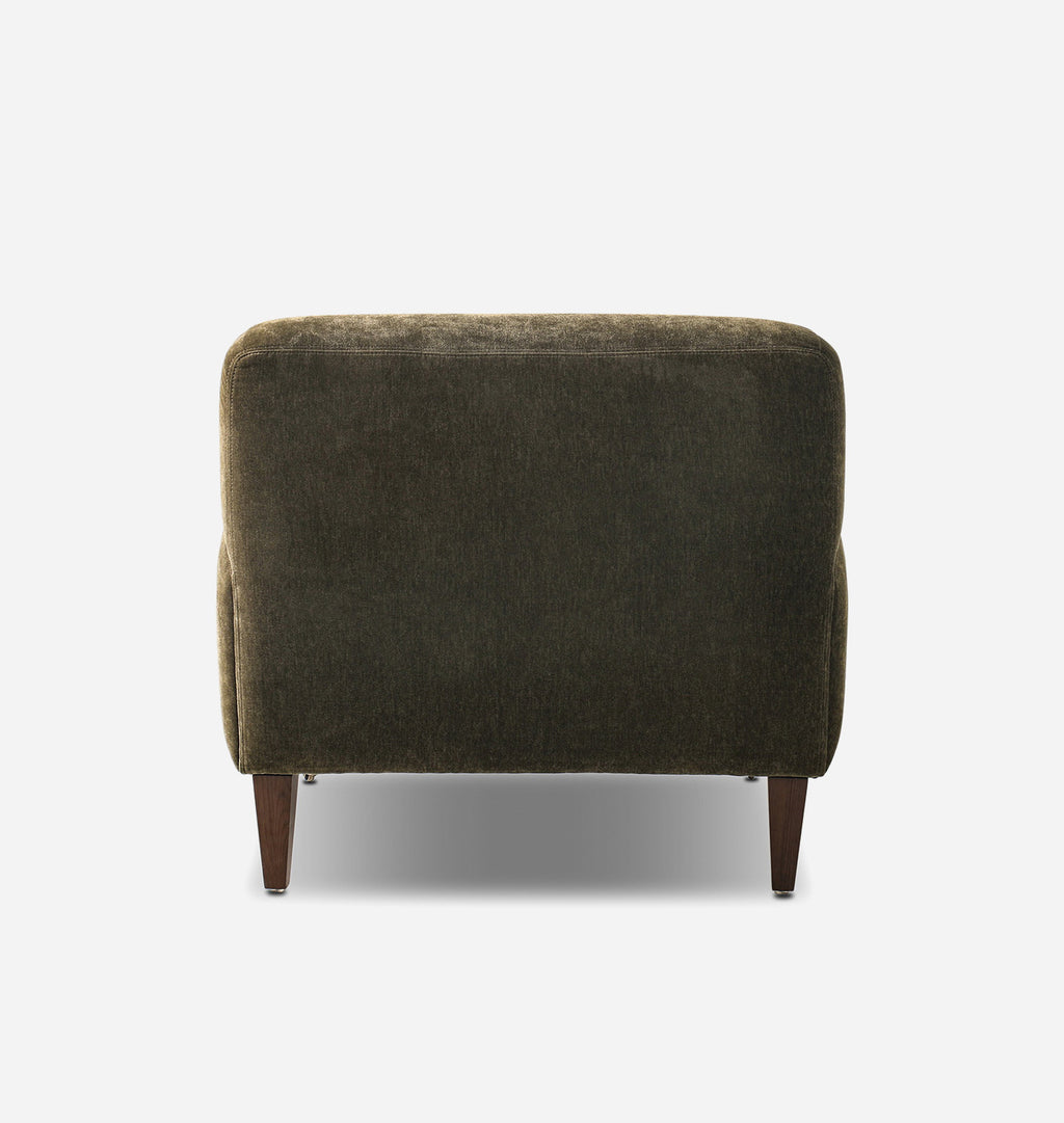 A single upholstered armchair shown from the back, featuring a dark olive green textured fabric and tapered dark brown wooden legs, set against a plain light gray background.