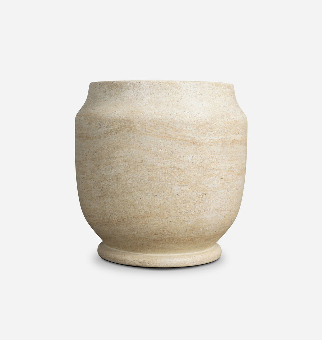 A small round planter pot made of beige travertine stone with natural horizontal veining, shown on a clean white background.