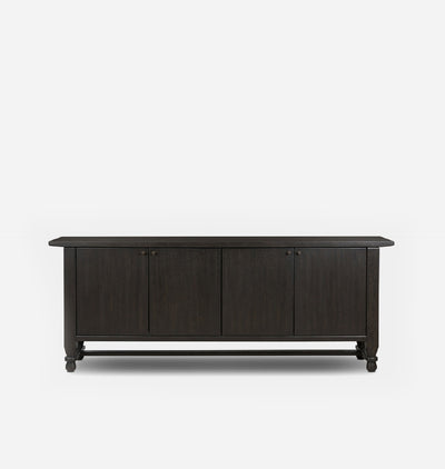 A dark brown wooden sideboard or credenza with four paneled doors and small round knobs, shown against a plain light gray background.
