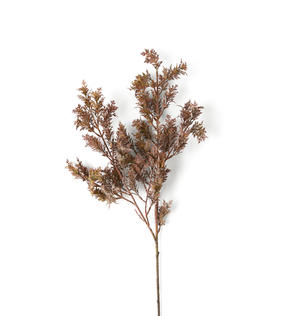 A single artificial branch with dense, feathery foliage in muted brown and bronze tones, isolated on a solid white background.