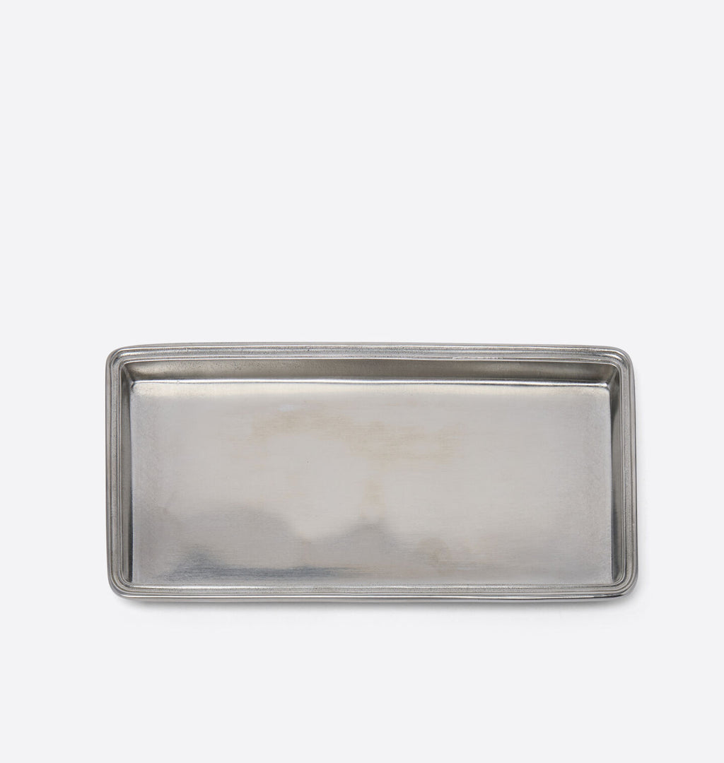A rectangular silver pewter tray with a brushed metallic finish and raised edges, photographed from above on a clean white background.