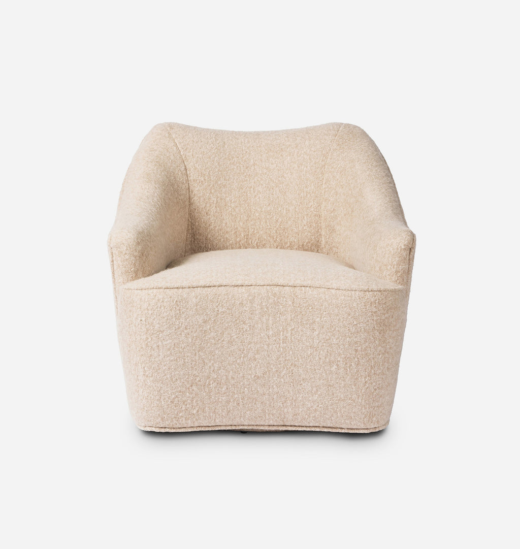 A modern low-profile accent chair upholstered in a textured beige bouclé fabric, shown from the front against a plain white background.