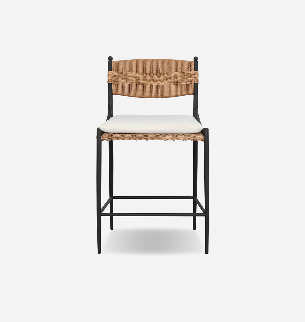 A modern counter stool with a black metal frame, a woven natural backrest and seat, and a white cushioned seat pad, shown against a light gray background.