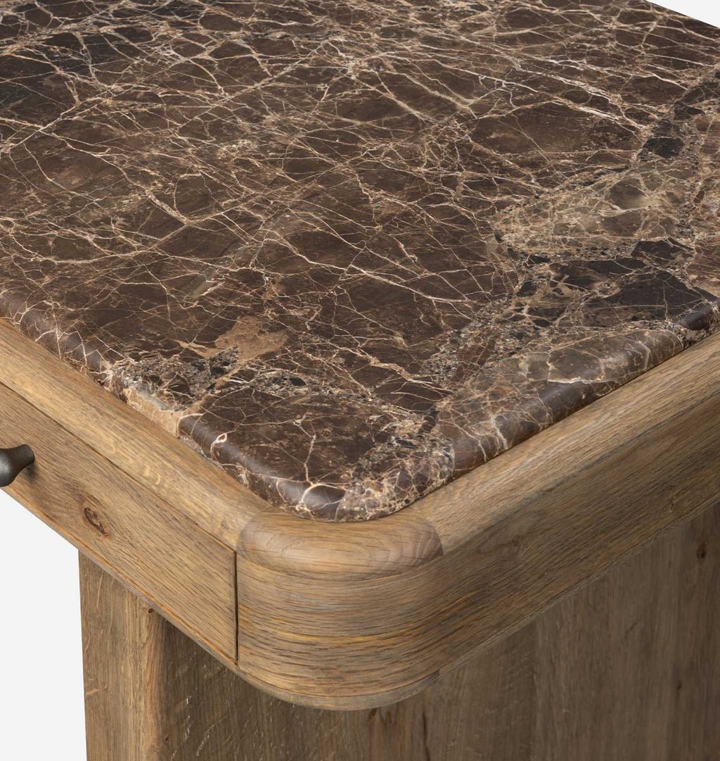 Close-up of a wooden table corner showing a dark brown marble top with natural veining and a medium brown wood frame.