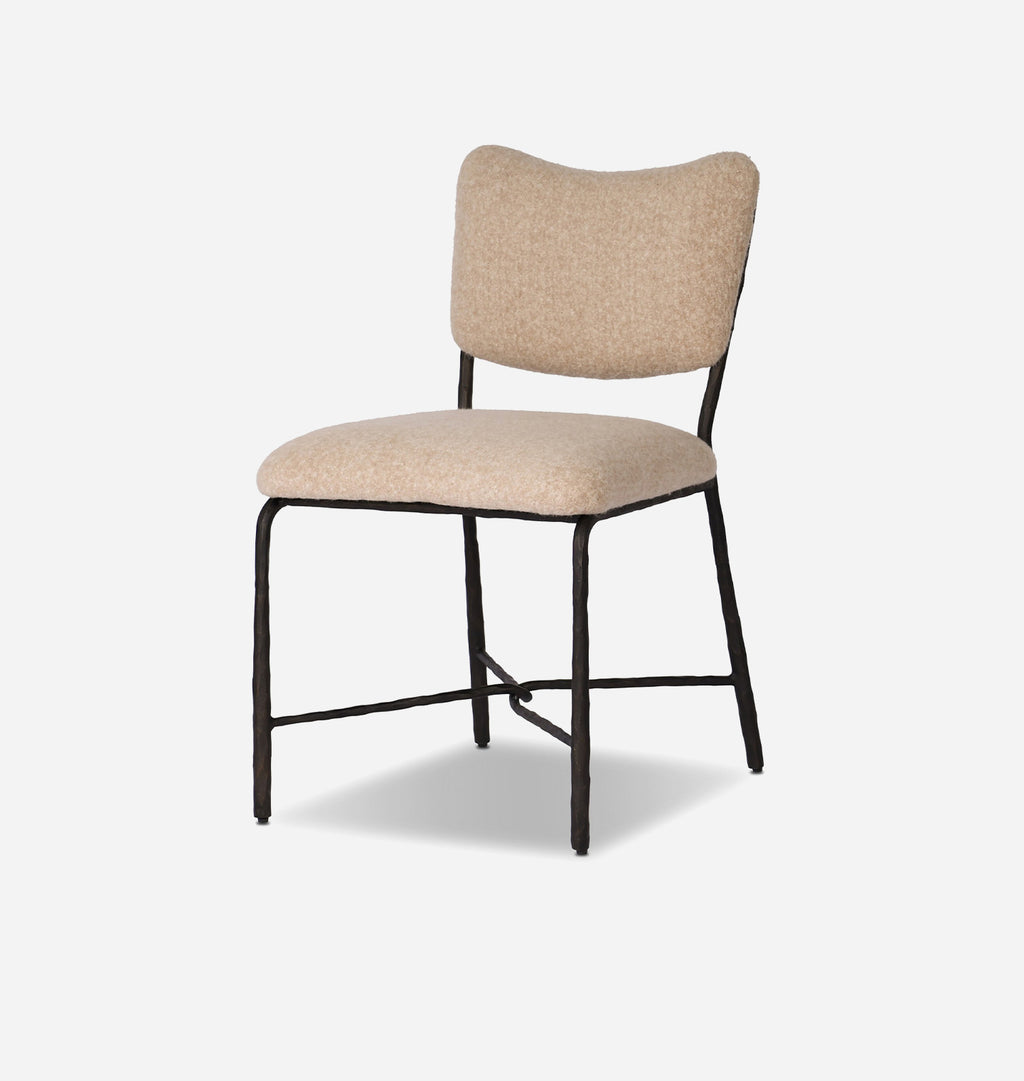 A modern dining chair with a curved backrest and a padded seat, upholstered in a textured beige fabric with a black metal frame, shown against a light gray background.