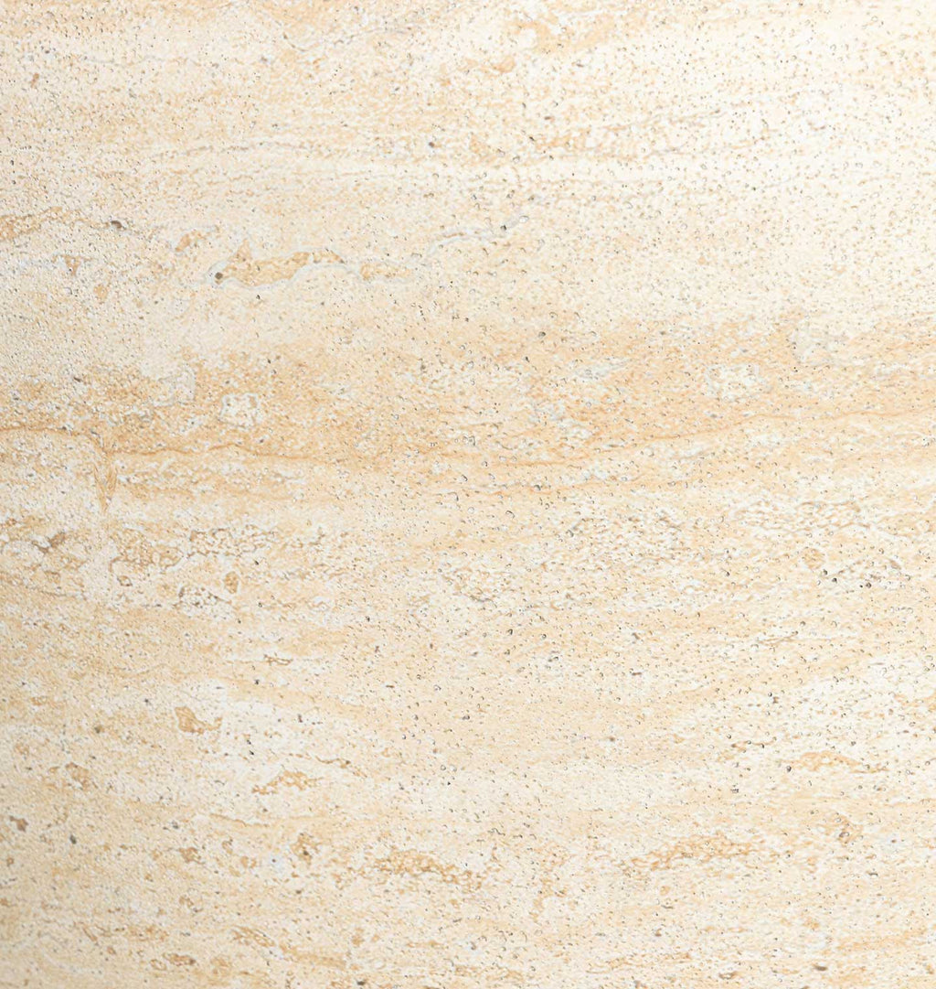 A close-up texture of a light beige stone or tile surface with subtle natural variation and fine speckling.