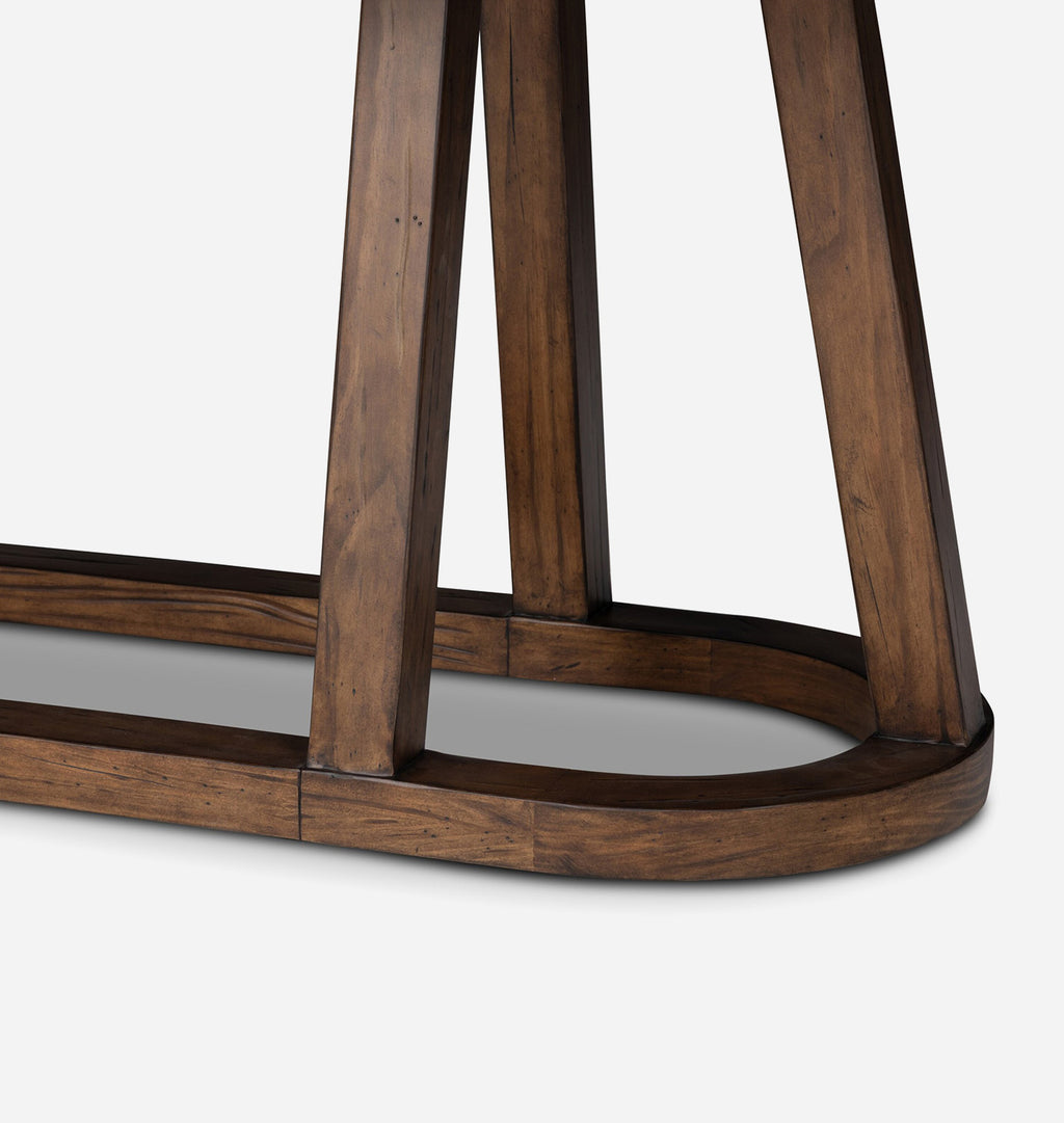 Close-up of a dark brown wooden table base with a curved apron shown against a light gray background.