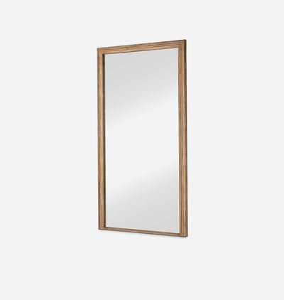 A tall, narrow rectangular wall mirror with a rustic light brown wooden frame, shown against a plain light gray background.