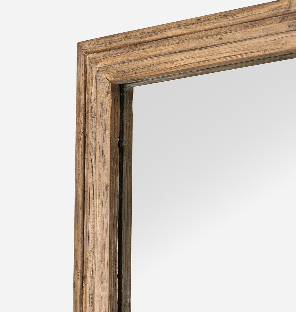 Close-up of a rustic wooden frame corner with a natural brown wood grain finish, set against a plain light gray background.