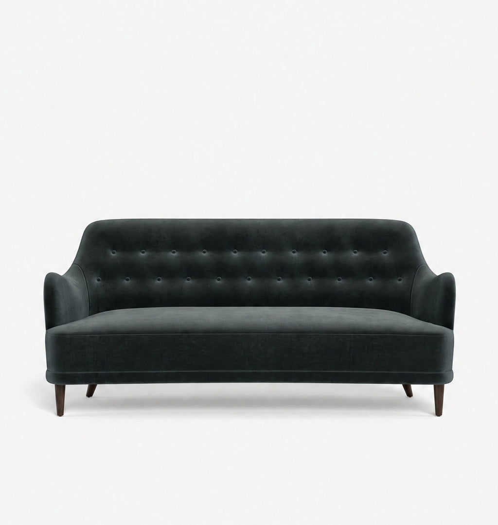 A dark green velvet loveseat sofa with button tufting on the backrest and tapered dark wood legs, shown against a plain white background.