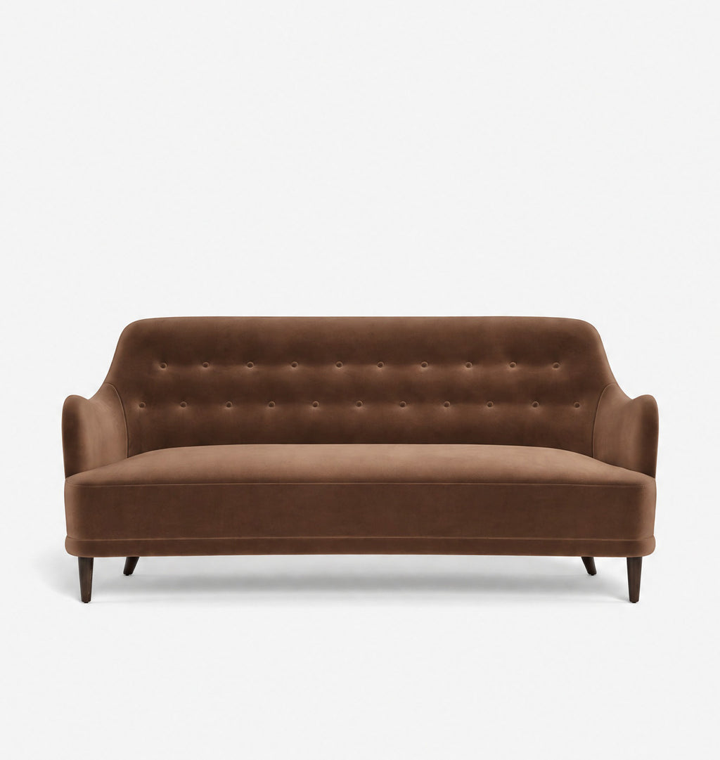 A brown velvet loveseat sofa with a tufted backrest and dark tapered legs, shown against a plain light gray background.