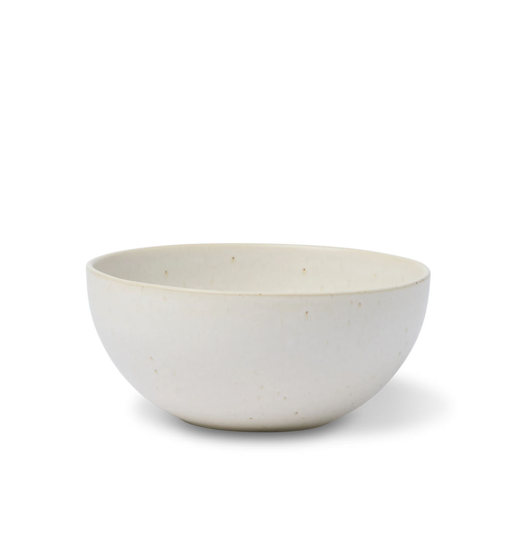 A ceramic pasta bowl finished in an off-white glaze shown on a white background