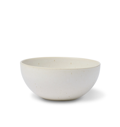 A ceramic pasta bowl finished in an off-white glaze shown on a white background
