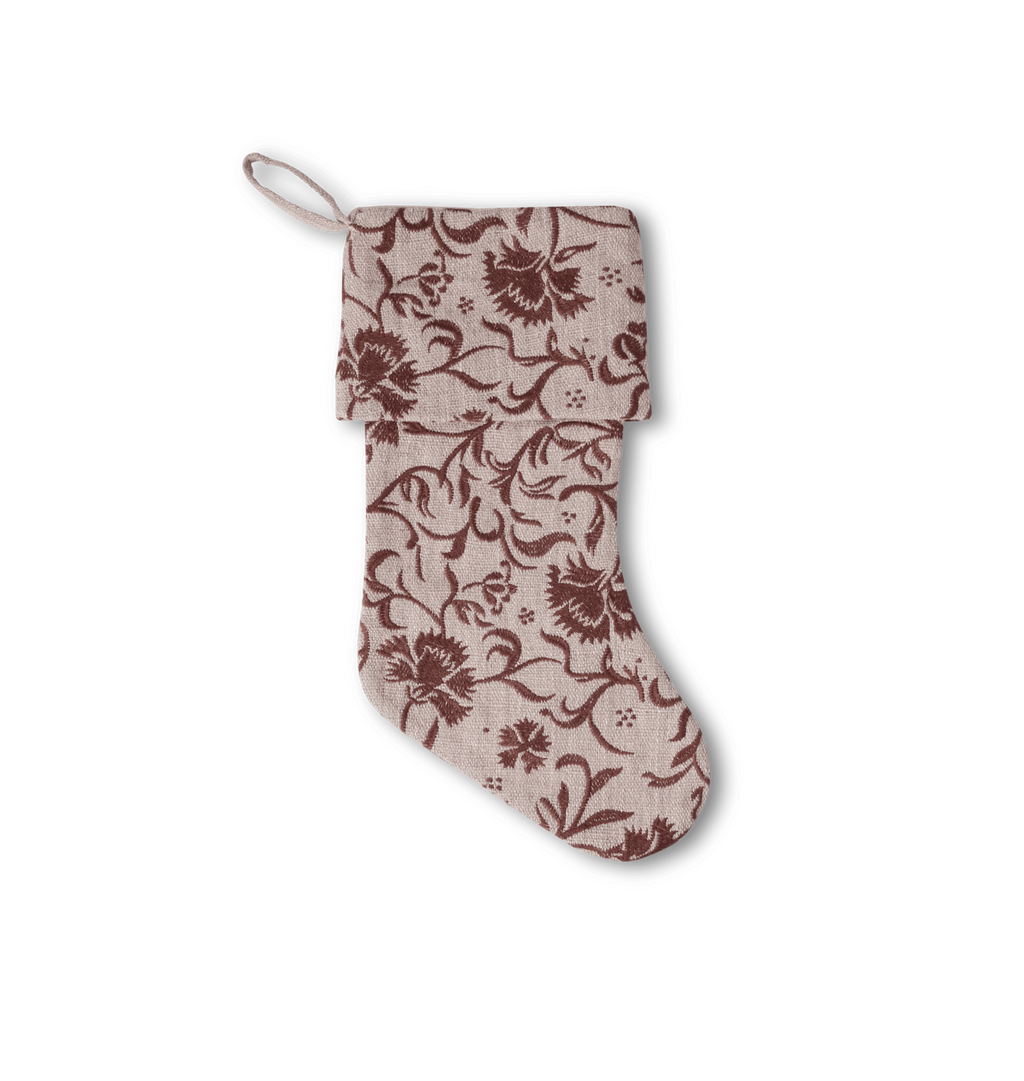 An floral embroidred socking on a white background