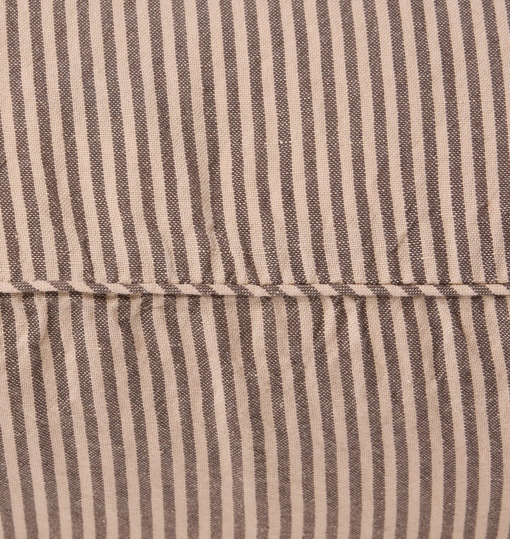 Close up detail shot of self welt seam on a striped pillow