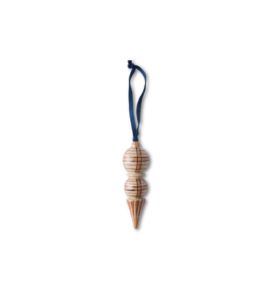 A hand-painted wooden ornament with traditional plaid patterns with a velvet ribbon tie set on a white background