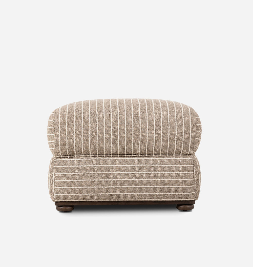 A low-profile upholstered ottoman covered in a beige fabric with thin white vertical stripes, shown against a plain white background.