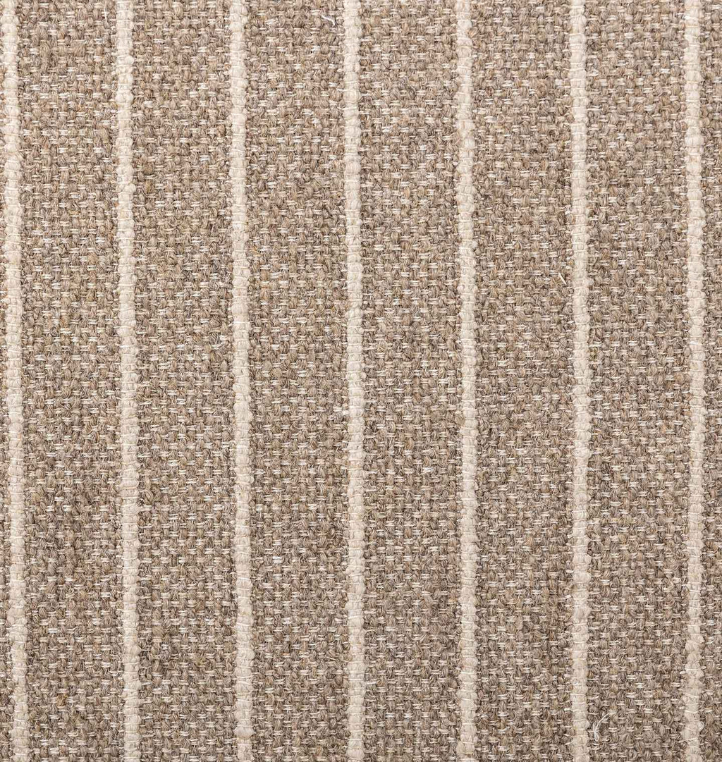 A close-up of woven fabric with a textured taupe-brown base and vertical off-white stripes.