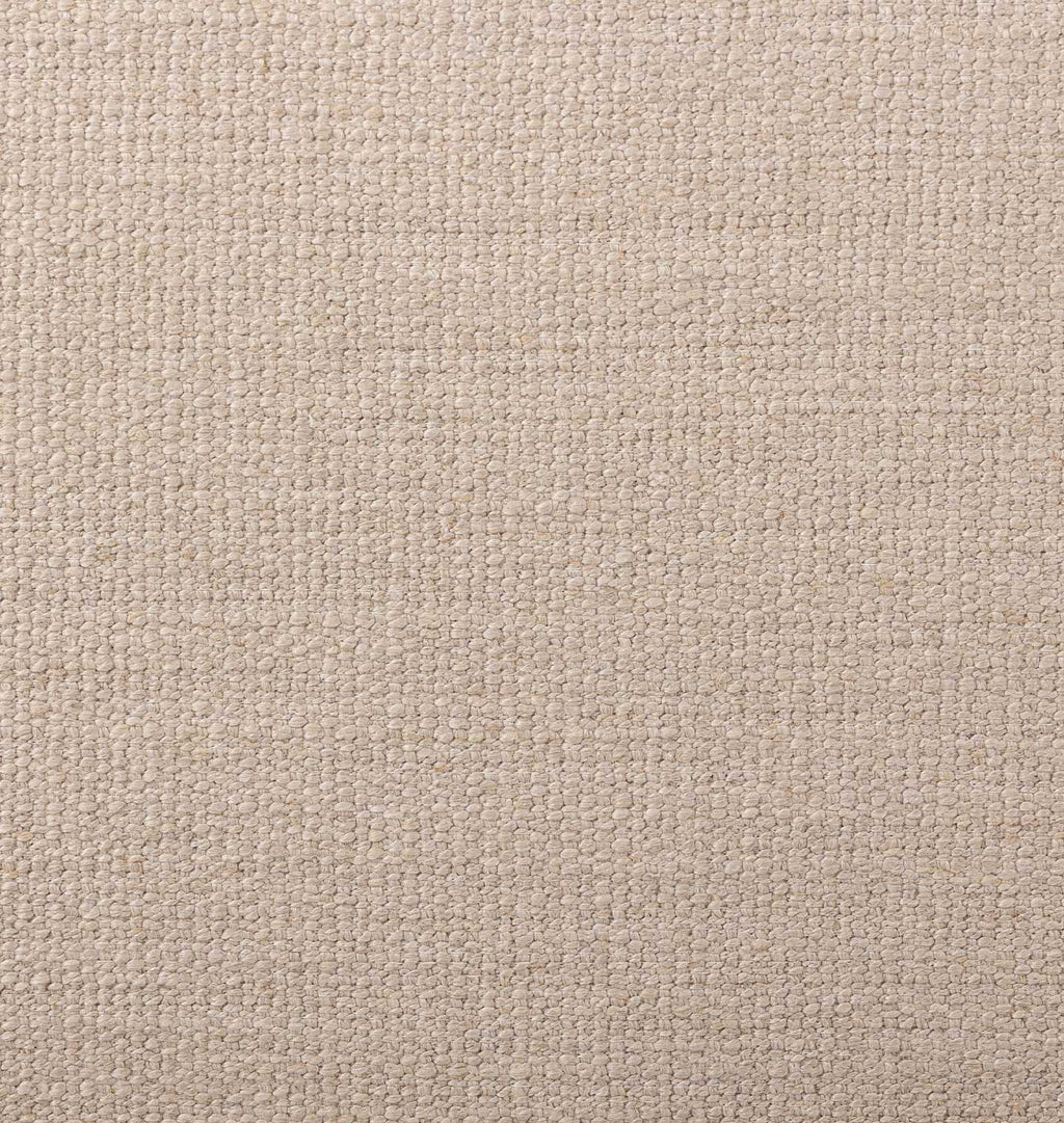 A close-up of a woven fabric texture in a light beige or oatmeal color, showing the detailed weave pattern.