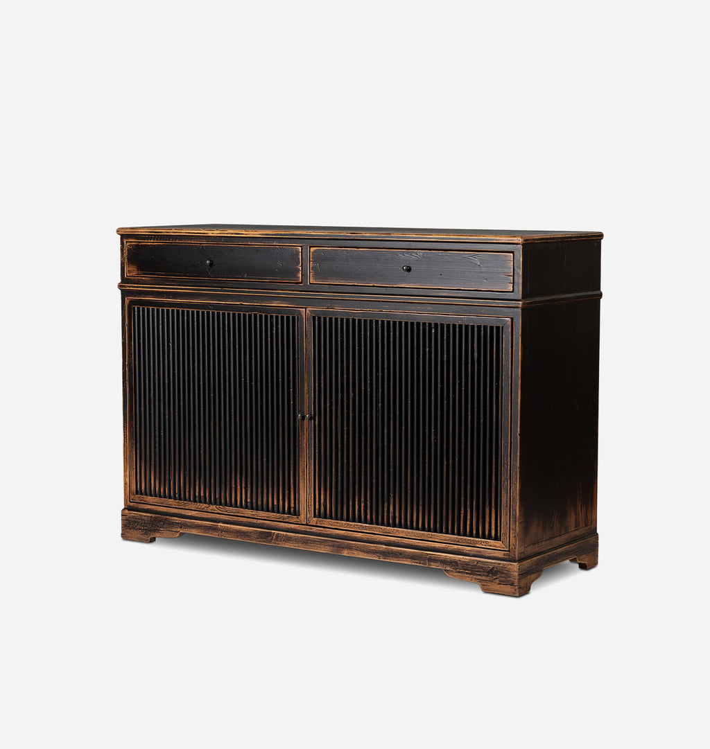 A dark brown wooden sideboard cabinet with two drawers on top and two vertically-slatted doors below, shown on a light gray background.