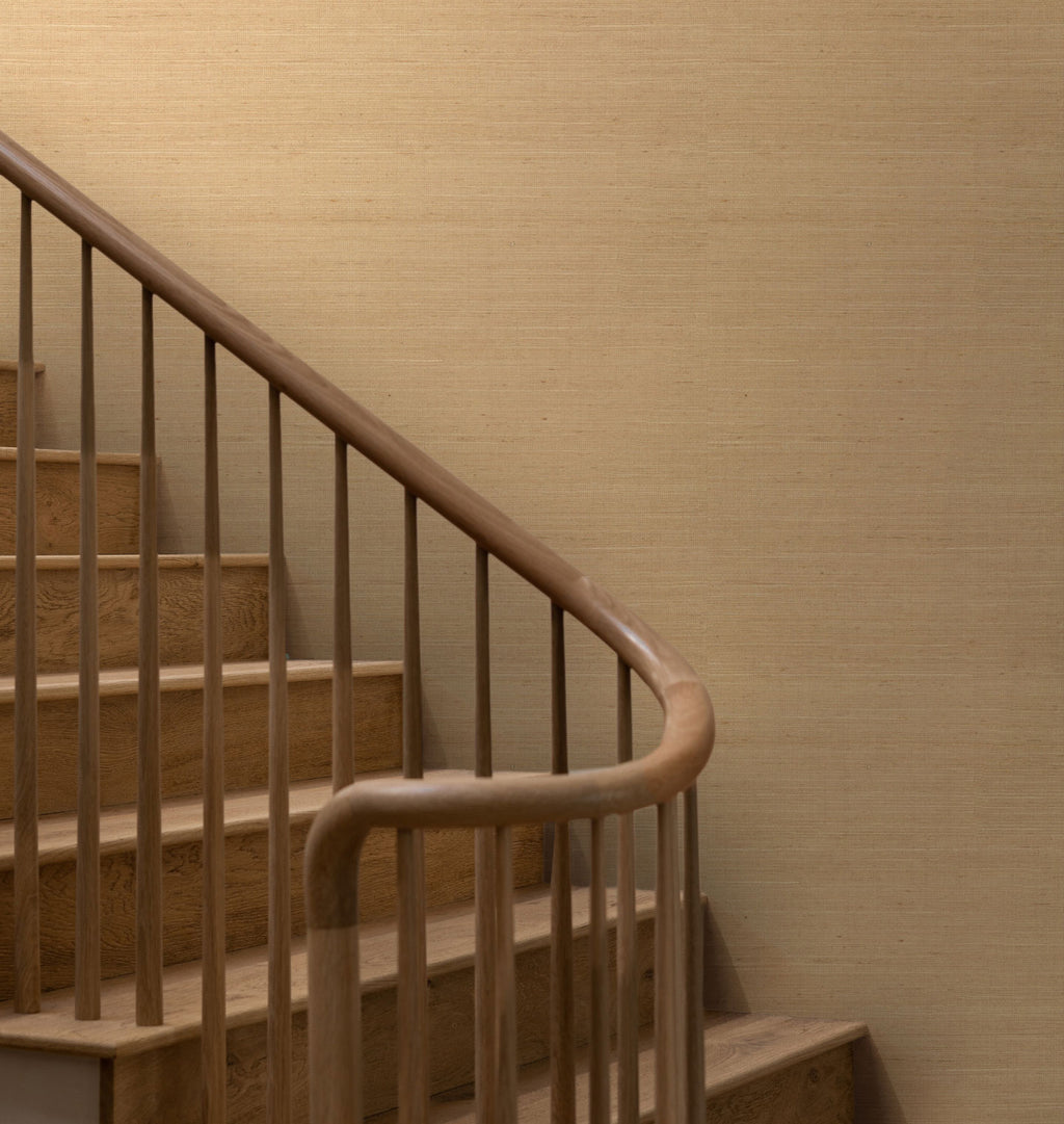 Field wallpaper in the color Brush, on a wall with a staircase