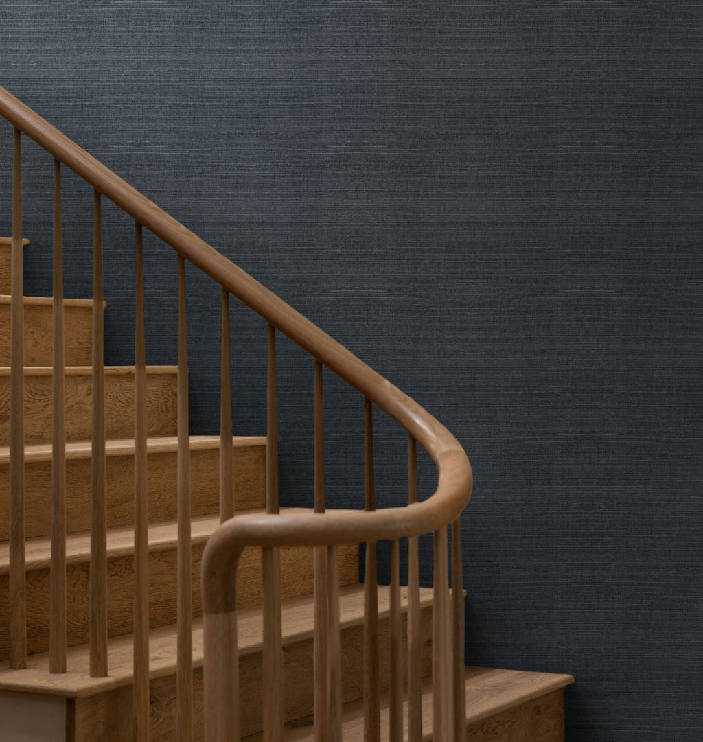 Field wallpaper in the color Laurel, on a wall with a staircase