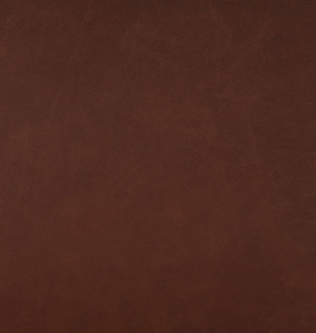 A close-up of a smooth, dark brown textured material surface, likely leather or faux leather.
