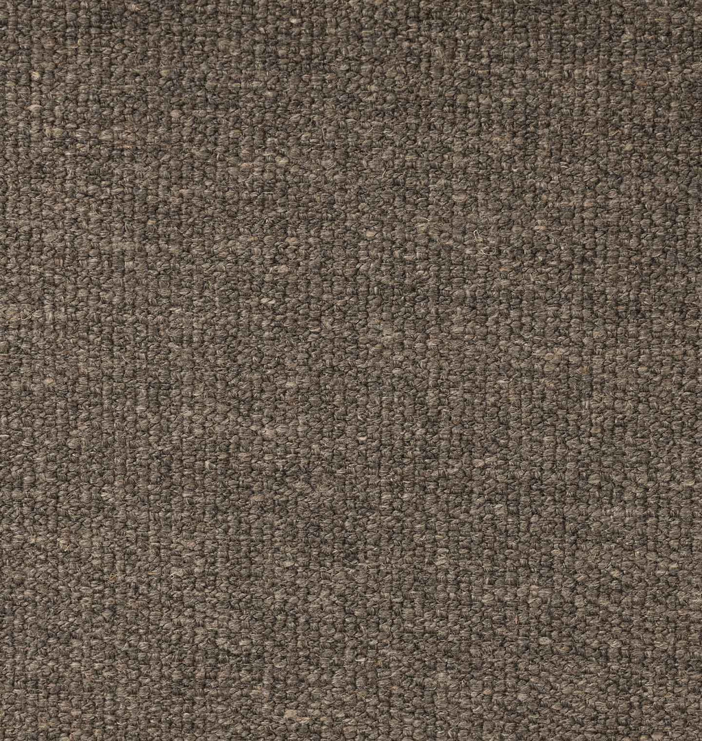 A close-up texture shot of a heathered brown and beige fabric with a tightly woven, looped pile.