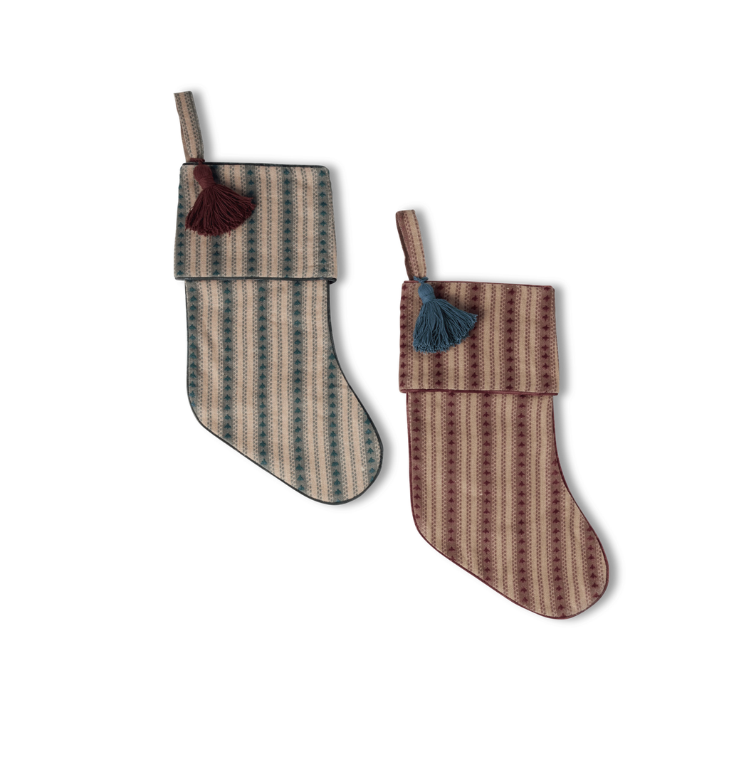 A pair of embroidered striped stockings with contrast tassels shown on a white background