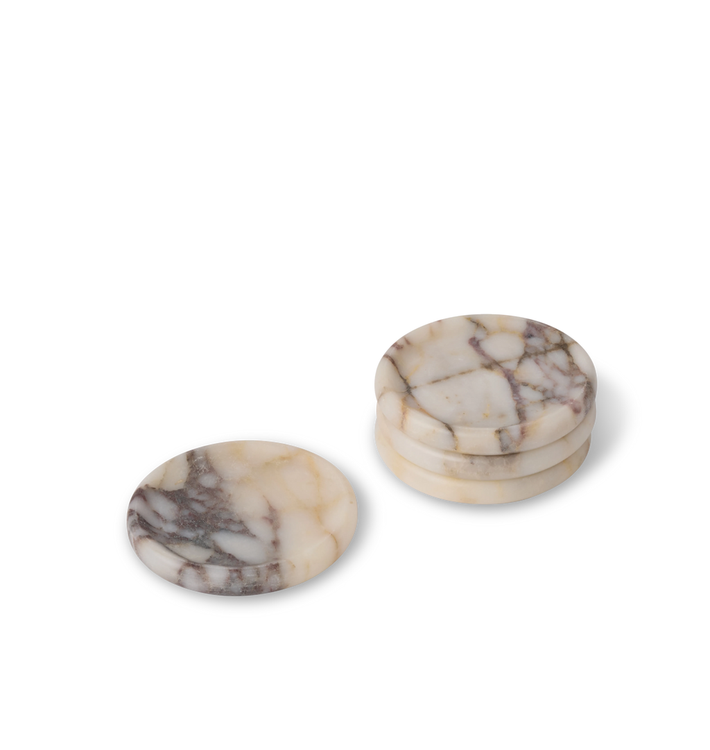 A set of of  a calacatta viola marble coaster with light grey and violet veining set against a white background.